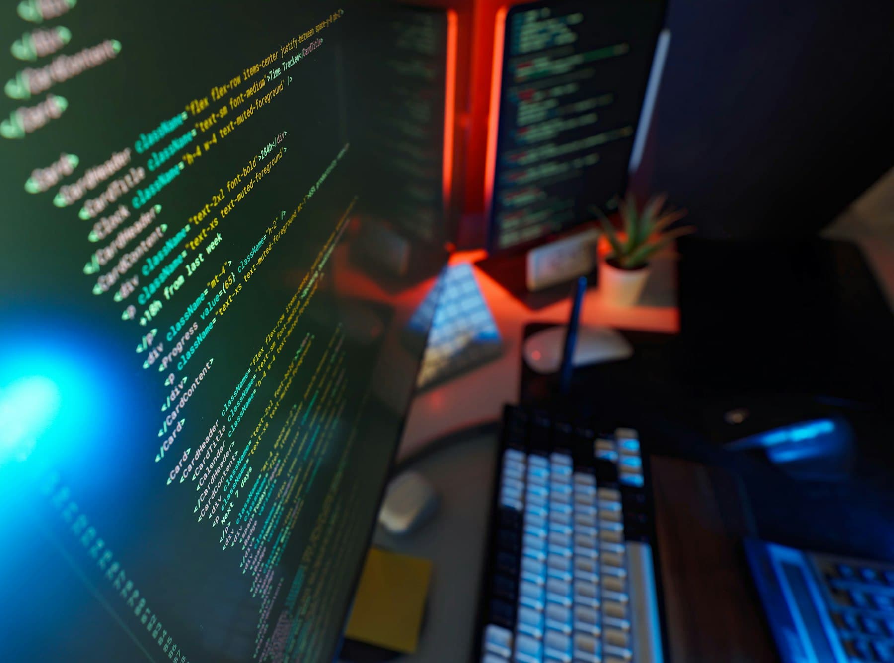 A developer workstation with code on dual monitors